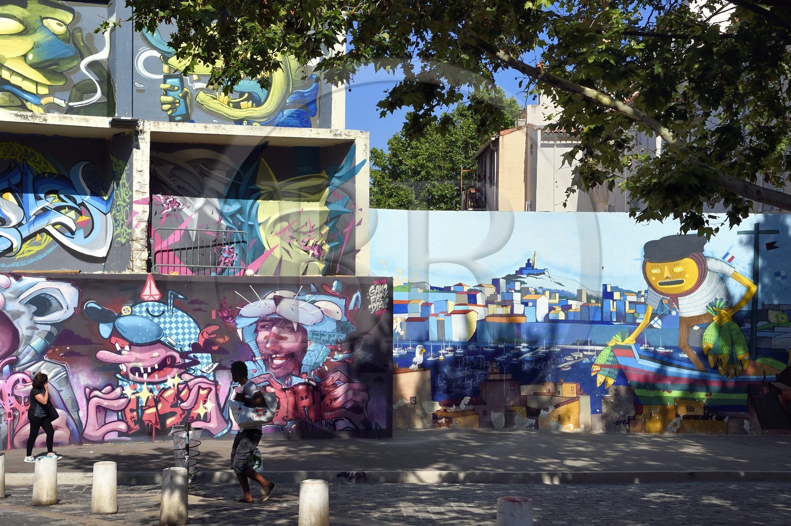 France, Bouches du Rhone, Marseille, Panier district, rue du Petit Puits, graff, the Sardine Fisherman and the Old Port, signed by the Brazilian graffiti artist Nhobi and Seek 313 right and Pierre aka alias Gamo left