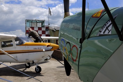 United Kingdom, England, East Yorkshire, Breighton Airfield, small single-engine two-seater biplane of tourism and aerial sport Bücker Jungmann with the colors of Nazi Germany and Cessna