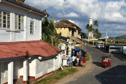 Sri Lanka, Southern Province, Galle Fort, listed as World heritage by UNESCO, old colonial houses on the ramparts street and the lighthouse in the background
