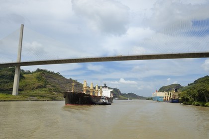 Panama, Panama Canal, Panamax cargo and the Centennal bridge (puente Centenario) spanning the Canal