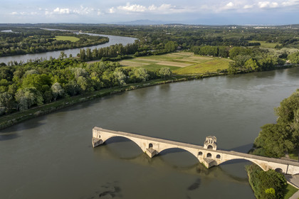 France, Vaucluse, Avignon, the Saint-Bénézet bridge (Avignon bridge) and the Ile de la Barthelasse between the two arms of the Rhone river (aerial view)