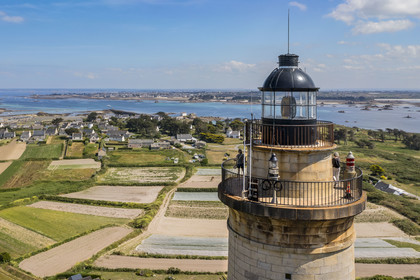France, Finistère, Ponant Islands, Ile de Batz (Batz Island), the lighthouse commissioned in 1836 overlooks the fields of the Island (aerial view)