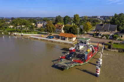 France, Seine-Maritime, Pays de Caux, Norman Seine River Meanders Regional Nature Park, the ferry crossing the Seine at Jumieges which abbey is in the background