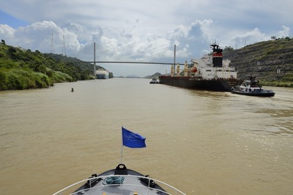 Panama, Panama Canal, Panamax cargo and the Centennal bridge (puente Centenario) spanning the Canal