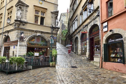 France, Rhone, Lyon, historical site listed as World Heritage by UNESCO, Vieux Lyon (Old Town), Saint George district, the place de la Trinite with the Café du Soleil served as the backdrop for the puppeteers putting on Guignol shows, and the montee du Gourguillon on the right