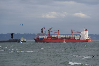 France, Seine Maritime, Le Havre, kitesurfing on the main beach at the harbor entrance and close to the passage of large container ships