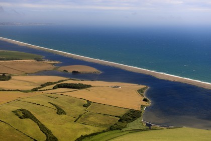 United Kingdom, England, Dorset, the Fleet Lagoon and Chesil Beach feature in the novel Moonfleet by J. Meade Falkner (1898) and the Isle of Portland in the background (aerial view)