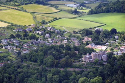United Kingdom, England, Somerset, Dunster Castle is a former motte and bailey castle that belonged to the Luttrell family (aerial view)