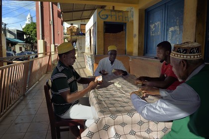 France, Mayotte island (French overseas department), Grande-Terre, Sada, domino players wearing an embroidered kofia, traditional Comoran hat