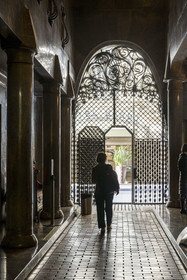 Spain, Catalonia, Barcelona, the Güell Palace (Palau Güell) built between 1886 and 1891 by the Catalan modernist architect Antoni Gaudi, a UNESCO World Heritage site, one of the two carriage entrances with parabolic vaults decorated with wrought iron grilles with complex designs