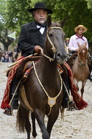 Argentina, Buenos Aires Province, San Antonio de Areco, Tradition Day festival (Dia de Tradicion), gaucho on horseback in traditional dress during the parade, estanciero (gaucho who owns a ranch)
