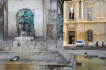 France, Bouches du Rhone, Arles, Place de la Republique, obelisk fountain and the the city hall in the background