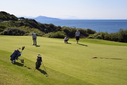 France, Pyrenees Atlantiques, Basque Country, Biarritz, golfers on the Ilbarritz golf course and Basque coast towards St Jean de Luz with the Pyrenees mountains in the background