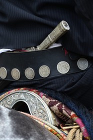 Argentina, Buenos Aires Province, San Antonio de Areco, Tradition Day festival (Dia de Tradicion) close up at a gaucho's traditional belt and the facon (wide and long knife)