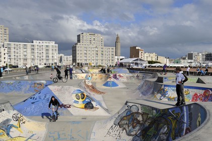 France, Seine Maritime, Le Havre, Downtown rebuilt by Auguste Perret listed as World Heritage by UNESCO, the Skate park on the beach, Perret buildings of Porte Océane (Ocean Gate) and St. Joseph's Church in the background