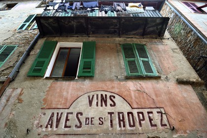 France, Alpes-Maritimes, Bevera Valley, Sospel, washing drying on the balcony of an old wine trade