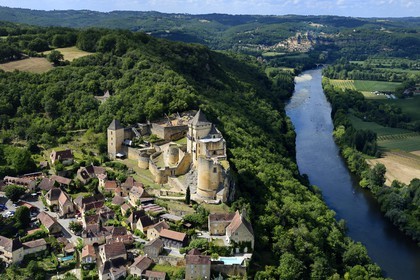 France, Dordogne, Perigord Noir, Dordogne Valley, Castelnaud la Chapelle, labelled Les Plus Beaux Villages de France (The Most Beautiful Villages of France), Castelnaud Castle on a cliff above the Dordogne valley (aerial view)