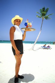 Dominican Republic, Altagracia province, Punta Cana, a hotel waitress on Bavaro beach