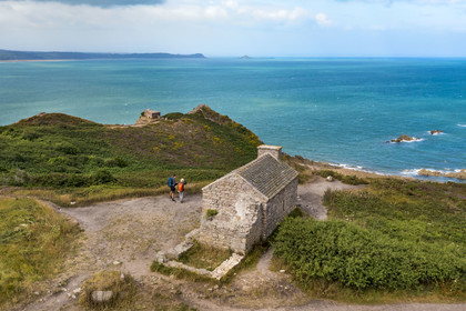 France, Cotes d'Armor, Grand Site de France Cap d'Erquy - Cap Frehel, Erquy, hikers on the GR34 hiking trail or coastal trail at Pointe des Trois Pierres on Cap d'Erquy (aerial view)