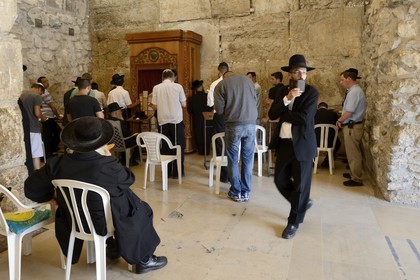 Israel, Jerusalem, holy city, the old town listed as World Heritage by UNESCO, covered part of the Western Wall part of the retaining walls of the Temple Mount built by Herod the Great, Orthodox Jews praying