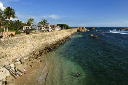 Sri Lanka, Southern Province, Galle Fort, listed as World heritage by UNESCO, old colonial houses behind the sea side walls of the fortified town