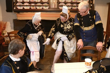 France, Finistere, Locronan, labelled Les plus Beaux Villages de France (The Most Beautiful Villages of France), adjustment of the traditional costumes the morning of the procession of the small Troménie in the Louboutin family farm