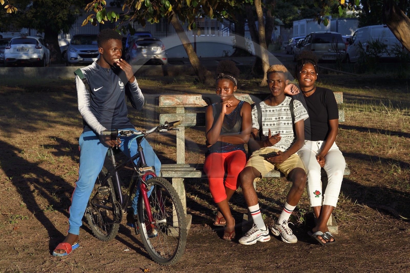 France, Mayotte island (French overseas department), Petite-Terre, Dzaoudzi, teens in discussion