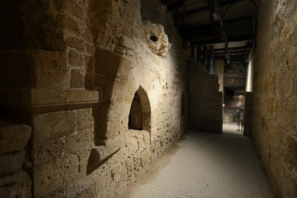 Israel, North district, Galilee, Acre (Akko), old town, listed as World Heritage by UNESCO, the Crusaders underground city just beside the Hospitaller fortress, the southern street and a shop wall