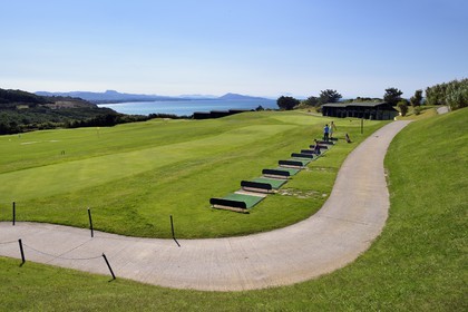 France, Pyrenees Atlantiques, Basque Country, Biarritz, golfers on the Ilbarritz golf course practice and Basque coast towards St Jean de Luz with the Pyrenees mountains in the background