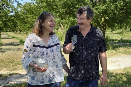 France, Meuse, Lorraine Regional Park, Cotes de Meuse, Combres sous les cotes, Domaine de Muzy, Véronique and Jean-Marc Liénard present their bottle of mirabelle plum brandy