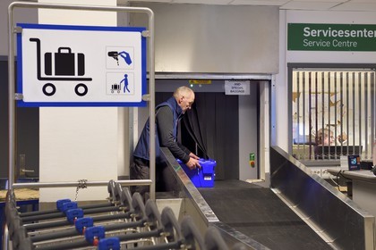 Norway, Svalbard, Spitzbergen, Longyearbyen, Svalbard Global Seed Vault (Seed Bank), arrival and scanning of seeds at the airport baggage claim area performed by NordGen