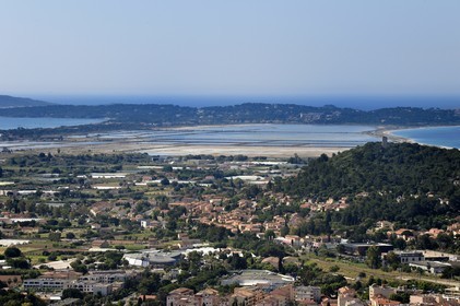 France, Var, Hyeres, Giens peninsula tombolo and Notre-Dame-de-Consolation chapel right, Hyères in the foreground