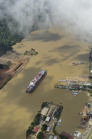 Panama, Panama Canal at Gamboa, Panamax container cargo and the Titan crane built by Nazi Germany on the right (aerial view)