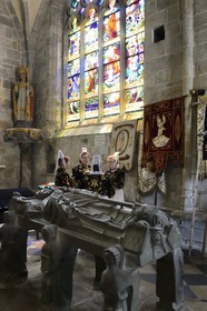France, Finistere, Locronan, labelled Les plus Beaux Villages de France (The Most Beautiful Villages of France), women in traditional costume during the Tromenie around the cenotaph of St Ronan in Peniti chapel adjacent to the Saint Ronan church