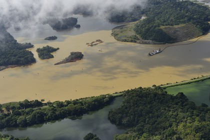 Panama, Panama Canal, the operation of dredgings are continuous because of the presence of the Chagres River which supplies with water the canal and Gatun Lake (aerial view)