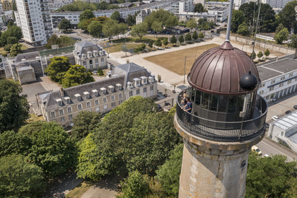 France, Morbihan, Lorient, the Enclos du port, tour de la découverte (the Discovery Tower), the time ball gives the solar time of noon each day as it falls, and the hotel Gabriel in the background (aerial view)