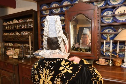 France, Finistere, Locronan, labelled Les plus Beaux Villages de France (The Most Beautiful Villages of France), adjustment of the traditional costumes the morning of the procession of the small Troménie in the Louboutin family farm