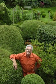 France, Finistere, Lannilis, Prat Ar Coum, the artist Loic Madec in his garden