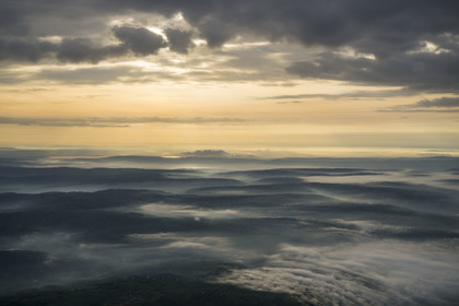 Rwanda, Eastern Province, the land of a thousand hills in the early morning mists (aerial view)