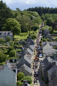 France, Finistere, Locronan, labelled Les plus Beaux Villages de France (The Most Beautiful Villages of France), return of the procession of the small Troménie at Saint Ronan church by Rue Saint Maurice