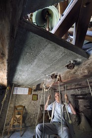 France, Alpes-Maritimes, Roya Valley (Nice hinterland), at the foot of the Mercantour National Park, Saorge, the belfry of Saint Sauveur parish church, the carillon being ringed by Bernard Duval also called Bena da Caranca
