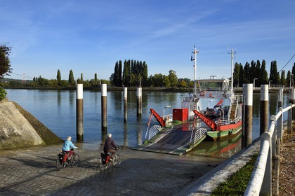 France, Seine-Maritime, Norman Seine River Meanders Regional Nature Park, the ferry crossing the Seine at the village of La Bouille, cyclists on the Veloroute of Val de Seine